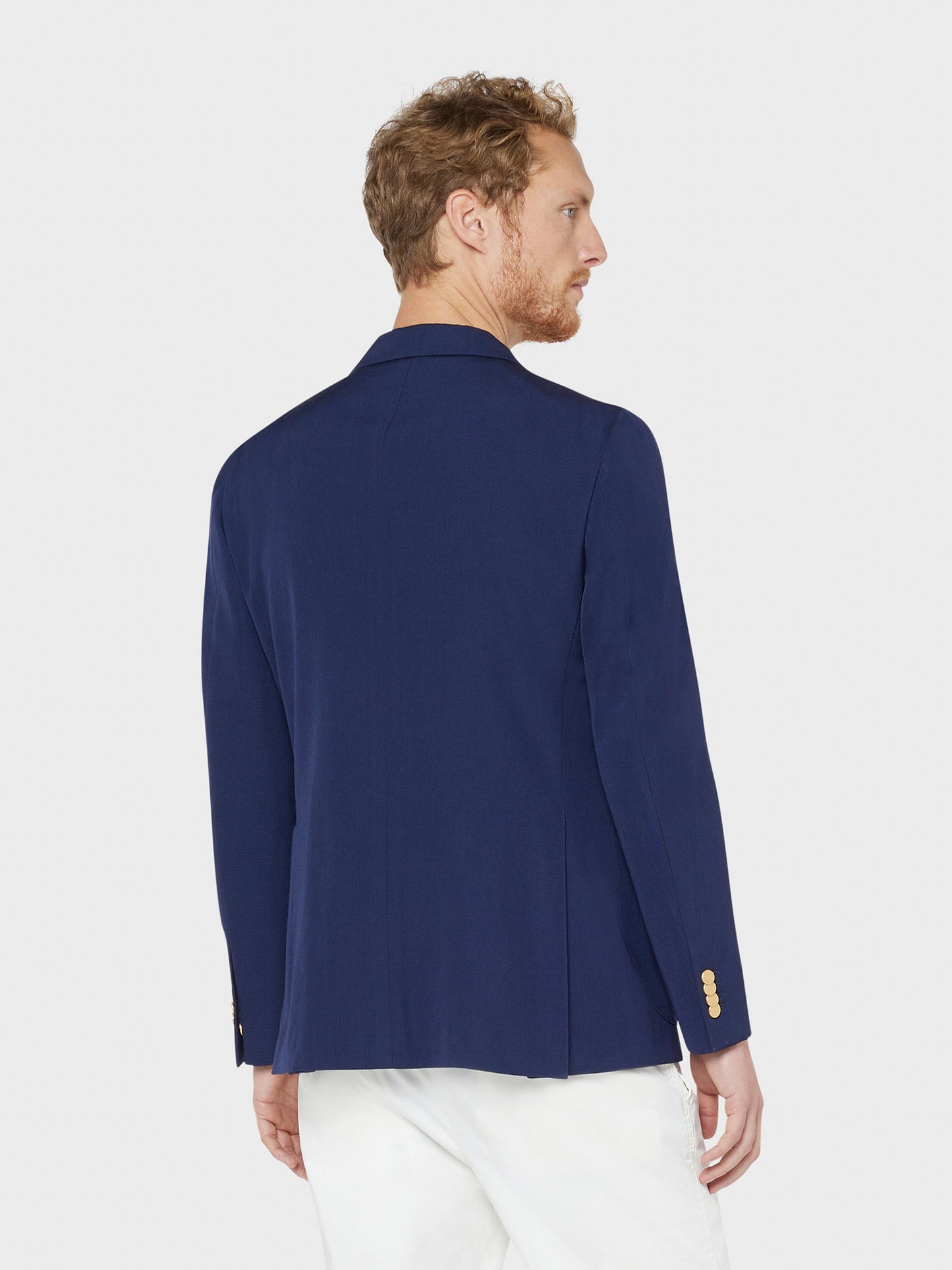 Caruso Menswear Abbigliamento Uomo Giacca Aida doppiopetto semisfoderata con rever a lancia in lana blu indossato drop 8R back