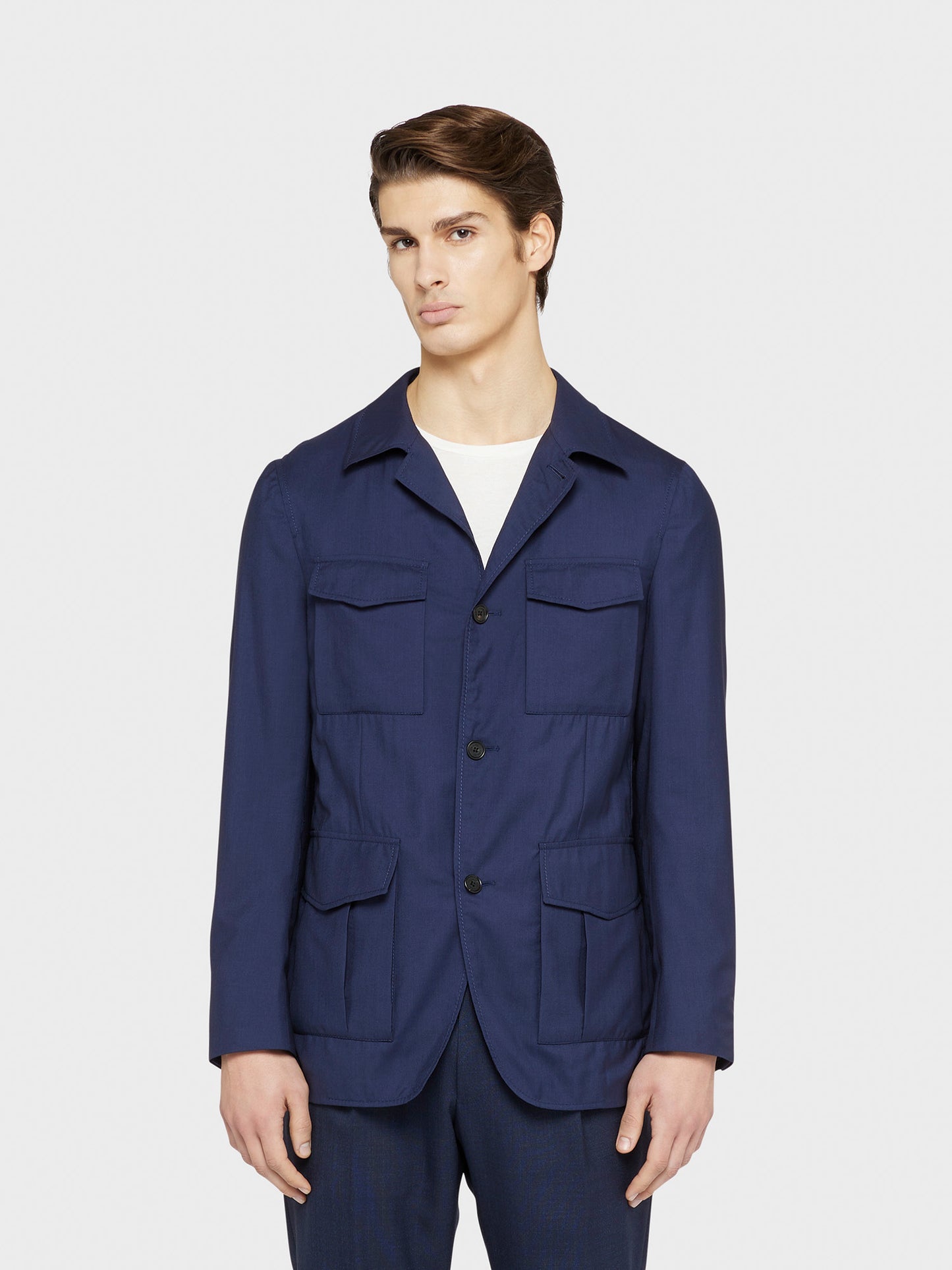 Caruso Menswear Abbigliamento Uomo Giacca Sahariana sfoderata estiva con quattro tasche a toppa di lana seta blu Nuage drop 8R indossato